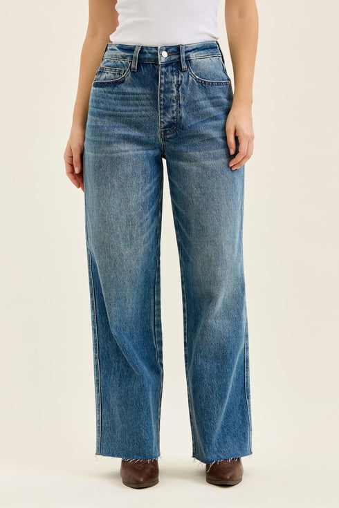 Judy Blue Wilhelmina vintage indigo baggy jeans, front view showing the wide legs and raw hem