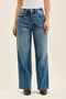 Judy Blue Wilhelmina vintage indigo baggy jeans, front view showing the wide legs and raw hem