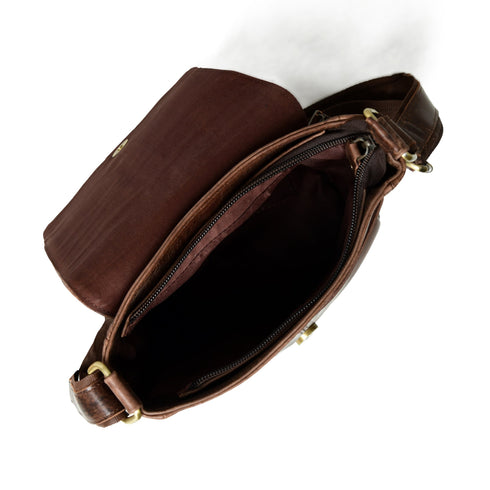 Open top of brown leather bag showing zipper and interior