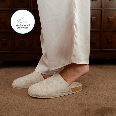 Beige Fulton House Shoe worn with cream pants, side profile of cork footbed