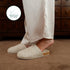 Beige Fulton House Shoe worn with cream pants, side profile of cork footbed