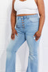 Jess plus-size jeans showing button fly and front distressing