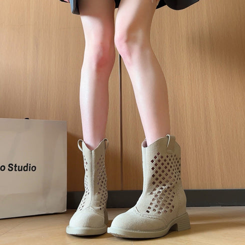 Front view of beige western ankle boots with square cutouts and pull tabs