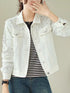 Closer front view of white jacket with decorative beads and buttons