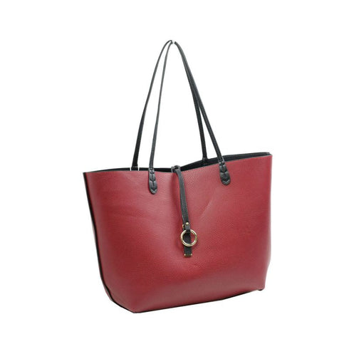 Red side of the Kendra reversible tote with black handles and decorative hardware — gallery image 8