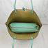 Interior view of a mint-green and gold Kendra reversible tote with the included small pouch — gallery image 15