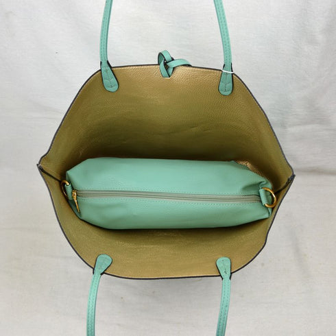 Interior view of a mint-green and gold Kendra reversible tote with the included small pouch — gallery image 60