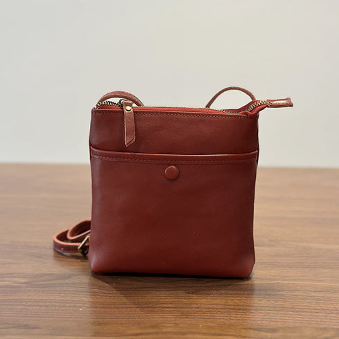 Red RockCow leather phone crossbody with adjustable strap and front snap detail