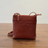 Red RockCow leather phone crossbody with adjustable strap and front snap detail