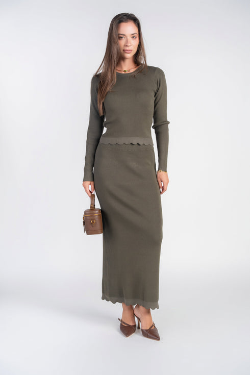 Model wearing olive scalloped skirt with matching top, sold separately