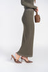 Side view of olive knit maxi skirt with a straight silhouette