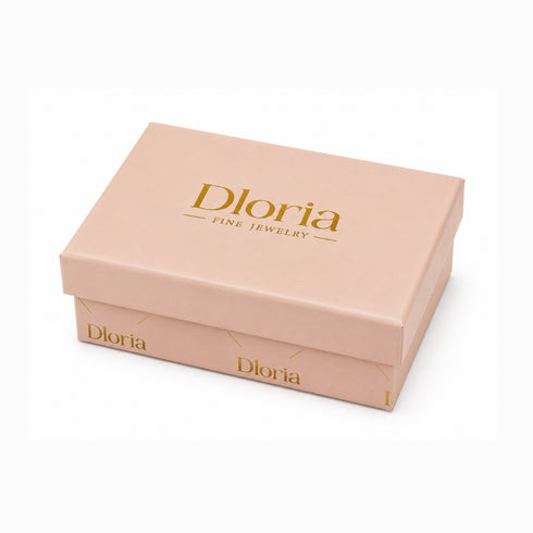 Blush Dloria jewelry gift box with gold lettering on the lid