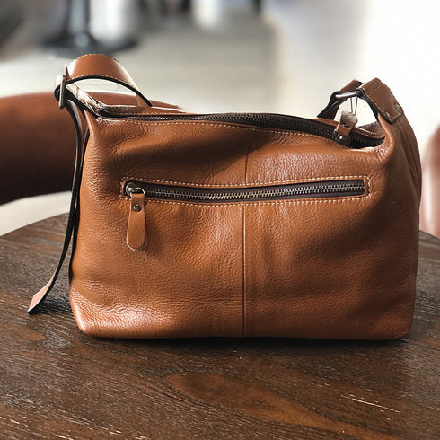Back of brown RockCow bag with horizontal zip pocket