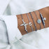 Gray and silver-tone bracelets with zigzag, globe and round accents