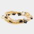 Black-and-white cross-accent five-piece stretch bracelet set with gold-tone beads
