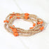 Orange cross-accent five-piece stretch bracelet set with gold-tone beads
