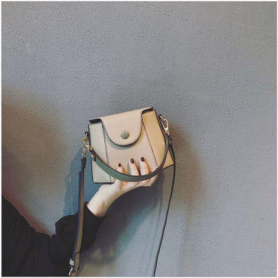 Khaki bucket bag showing long shoulder strap