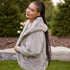 Side view of Grey Pretty Rugged cardigan showing the hood and ribbed sleeve cuff
