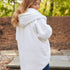 Back view of White Pretty Rugged cardigan showing the oversized hood