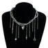 Dark layered necklace with heart and other charm drops displayed on a black bust