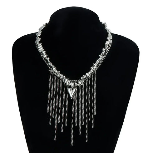 Chain-fringe necklace with pointed heart shown on a black jewelry bust