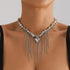 Silver-tone beaded necklace with dense hanging chain fringe, modeled