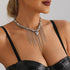 Long chain-fringe necklace with pointed heart charm, angled model view