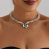 Clear-look beads and a large faceted-look heart, straight neckline close-up