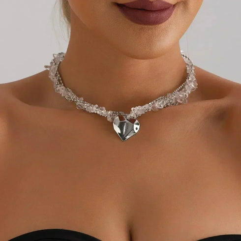 Clear-look beaded strand with a faceted-look silver-tone heart, front close-up