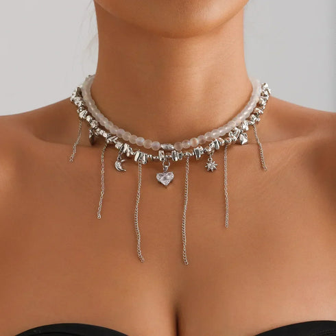 Silver-tone necklace with long beaded fringe and pointed heart, front modeled view