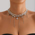 Silver-tone necklace with long beaded fringe and pointed heart, front modeled view