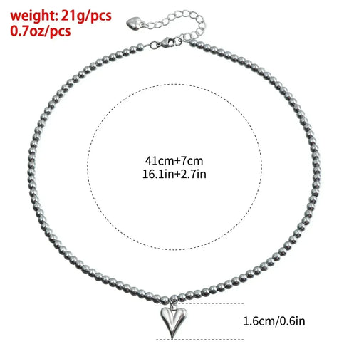 Supplier size diagram for a small pointed heart necklace showing 41 cm plus 7 cm extension