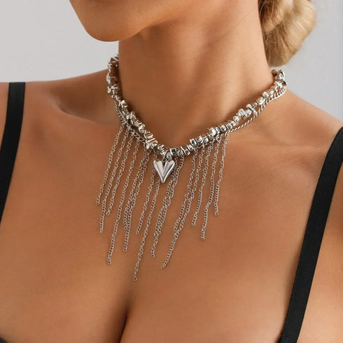 Silver-tone bead and chain-fringe necklace with pointed heart, angled close-up