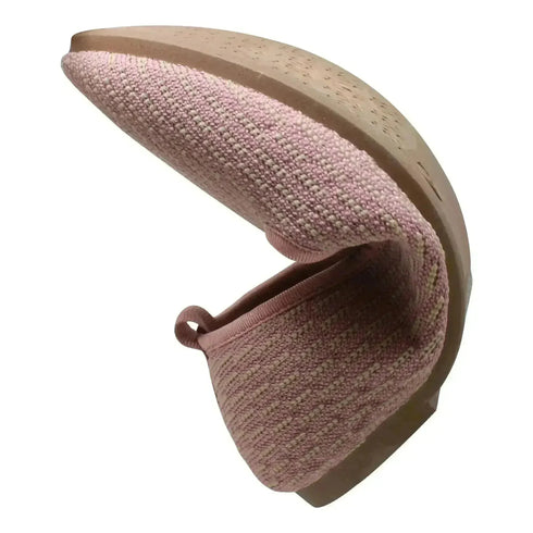 Pink SOBEYO ballet flat bent to show flexible rubber sole