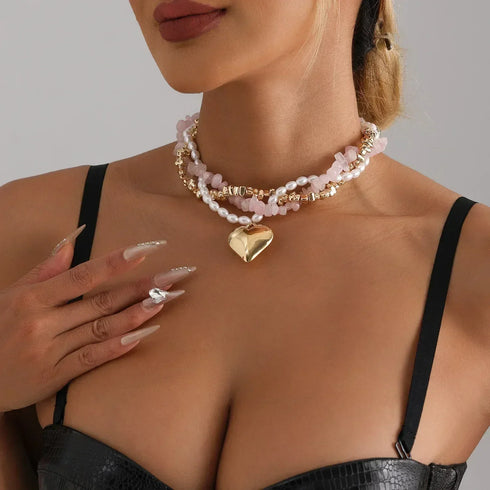 Pink and white double-beaded heart necklace, angled neckline view