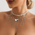 Pale beaded necklace with a large heart and long chain fringe, modeled