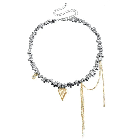 Mixed-tone bead and pointed heart necklace laid flat with extension chain visible