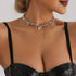 Asymmetric heart charm necklace with hanging chains, side neckline view