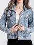 Light-blue pearl-style embellished jacket worn over a white top