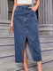 Front view of medium-blue denim midi skirt with front slit and pockets