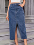 Front view of medium-blue denim midi skirt with front slit and pockets