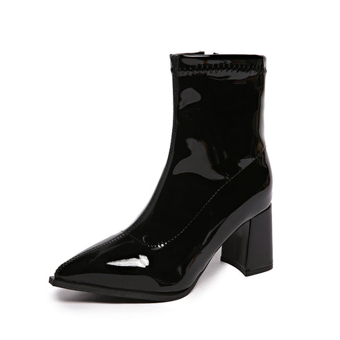 Side profile of Black pointed-toe ankle boot on a white background