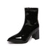 Side profile of Black pointed-toe ankle boot on a white background