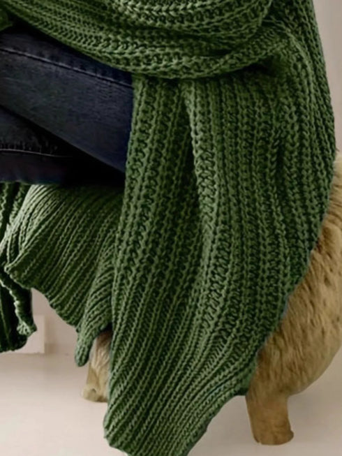 Close-up of Green cardigan sleeve and long knit body