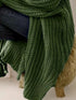 Close-up of Green cardigan sleeve and long knit body