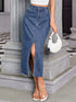 Denim midi skirt showing front slit while standing on steps