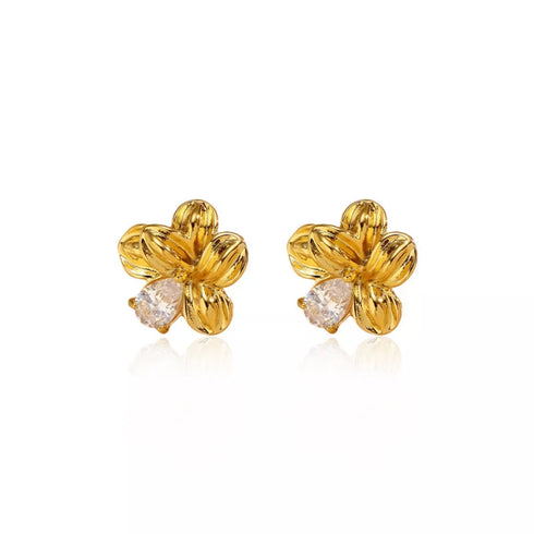 Pair of flower stud earrings with clear zircon accents on white