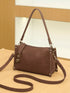 Brown Buckle-Detail Crossbody Bag: Brown bag, angled product view