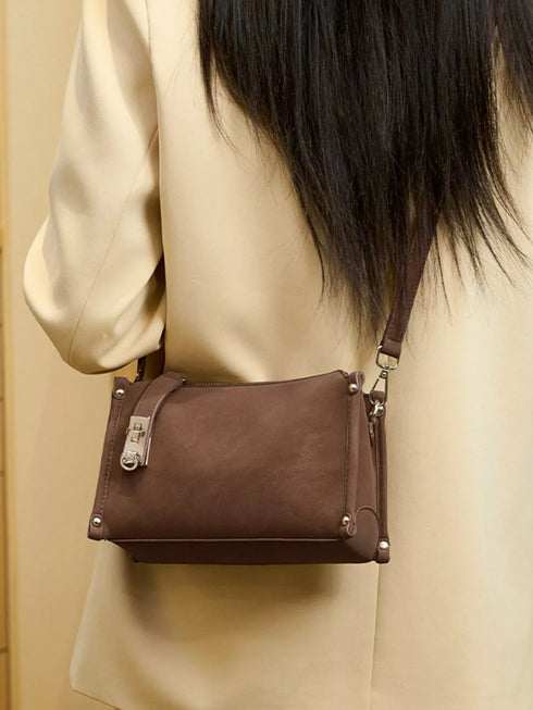 Brown Buckle-Detail Crossbody Bag: Brown rectangular crossbody bag worn, rear view