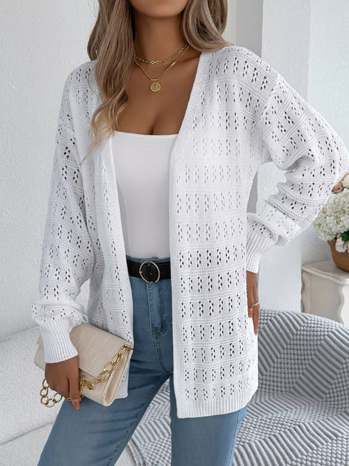 White crochet-knit cardigan, front view worn with a white top